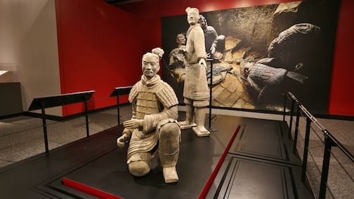 Two statues stand guard at the Franklin Institute's 'Terracotta Warriors of the First Emperor' exhibition. (Photo courtesy of the Franklin Institute.)