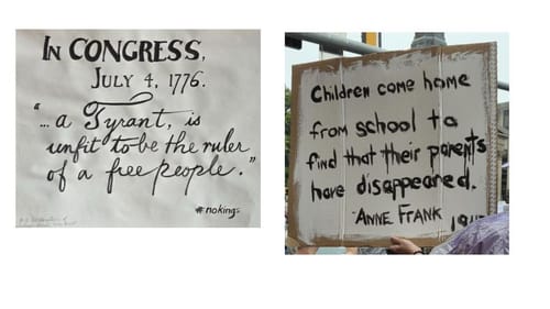 One sign quotes the Declaration with fancy script, and the other quotes The Diary of Anne Frank in stark painted letters.