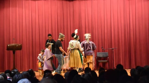 The Red Blanket Singers dance at the Parkway Free Library. (Image by Margaret Darby.)