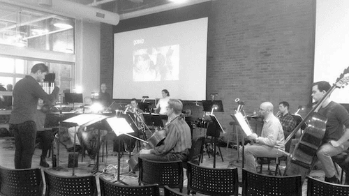 Ogren rehearsing with the Orchestra 2001 ensemble at the Center for Architecture and Design. (Photo by Seth Hanes)