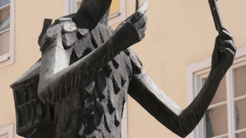 A stone sculpture of Papageno decorates a city square in Mozart's home of Salzburg, Austria. (Photo via Creative Commons/Wikimedia)