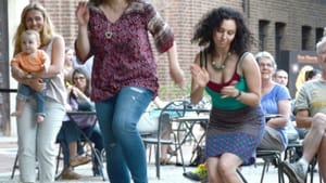 Last year's Summer Nights concertgoers dance in the courtyard. (Photo courtesy of Penn Museum.)