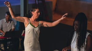 Hetherington, a white woman, and Roberson, a Black woman, perform together, each dancing on their own low wooden platform.