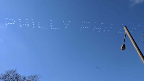 “Philly Philly” is written in a clear, blue sky via skywriting smoke from a plane.