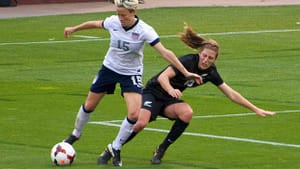 Megan Rapinoe (left) in a 2013 game against New Zealand. (Photo by Noah Salzman via Creative Commons/Wikimedia)