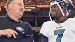 Coach Reid (left) with gunslinger Vick: The family that prays together...