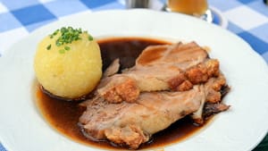 Schweinsbraten mit Kartoffelknödel (photo by Takeaway via Creative Commons/Wikimedia)