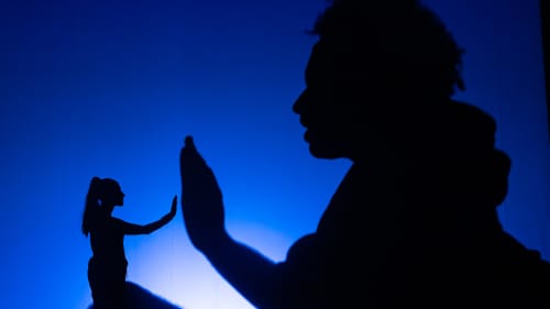 Thanks to a shadow silhouette effect, it looks like Hassan is 6 inches tall as she high-fives a human-size Dobson.