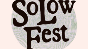 A logo with SoLow Fest written over a spiraling, faded background