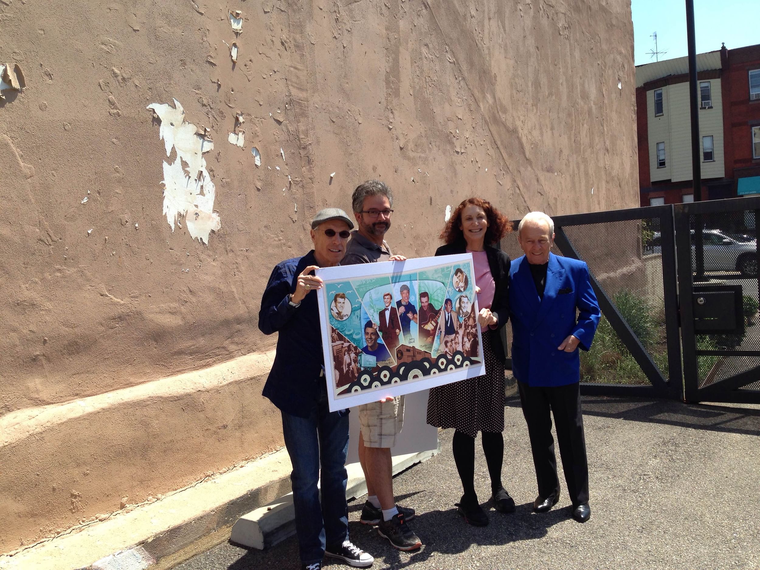 Jerry Blavat, Eric Okdeh, Jane Golden, and Charlie Gracie unveil the current design. (Photo by Alaina Mabaso.)