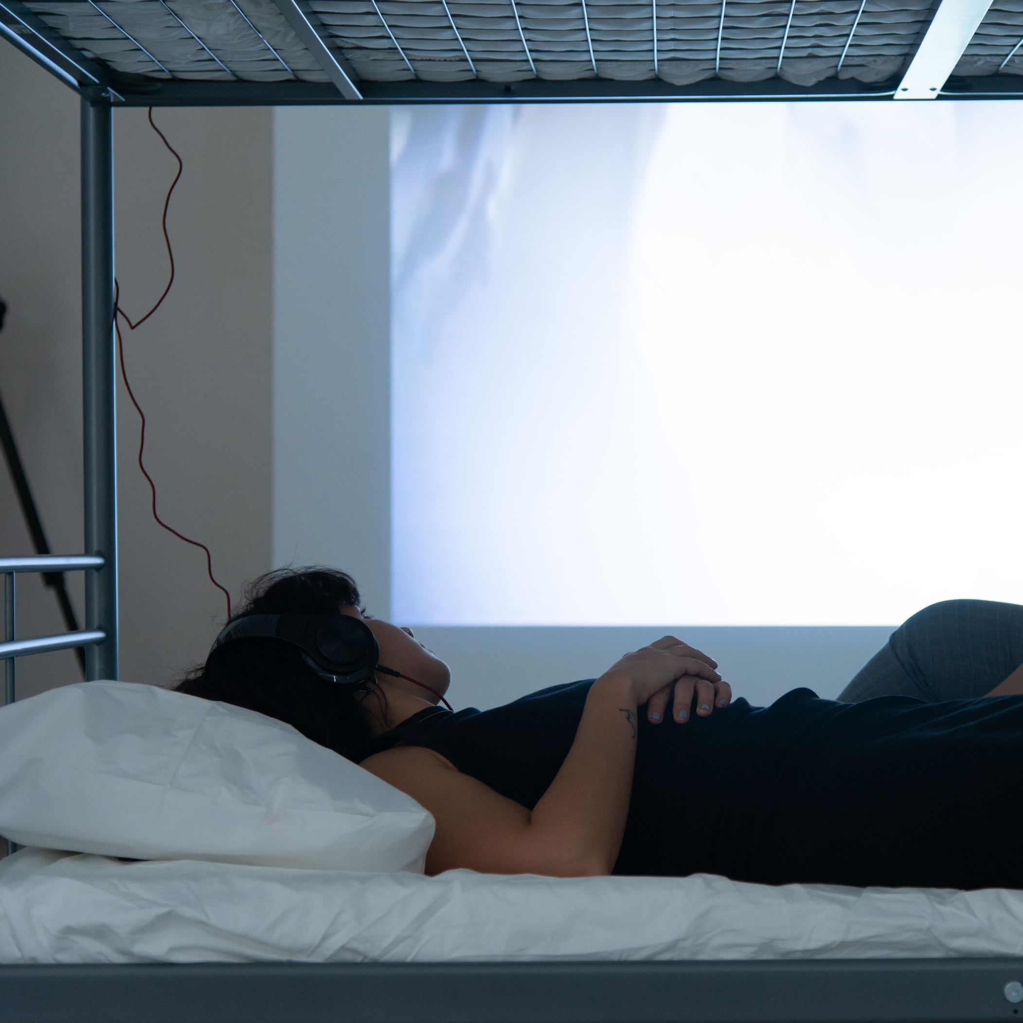 Refugee Basel Zaraa draws images of displacement on visitors' arms. (Photo courtesy of the artist.)