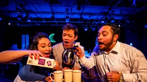 Three characters, mouths agape—maybe singing. Aprons and food service attire, hold a tray with three cups, milk, and pitcher