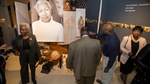 AAMP guests surround 'Ancestral Correspondence.' (Photo by Meredith Edlow)