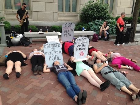#ReadAHCA's die-in. Vashti Bandy in pink pants, far right. (Photo by Alaina Mabaso)