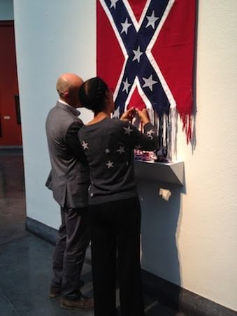 Artist Sonya Clark joins a participant during her performance piece, 'Unraveling.' (Photo by Alaina Mabaso.)