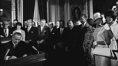 President Lyndon B. Johnson signs the Voting Rights Act of 1965. Obviously, racism did not end here. (Image via Wikimedia Commons.)