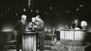 L to R: Penn anthropologist Carlton Coon, sculptor Jacques Lipschitz, and Alfred Kidder II, with Froelich Rainey at the desk, on the set of 'What in the World?' (Photo courtesy of Penn Museum.)