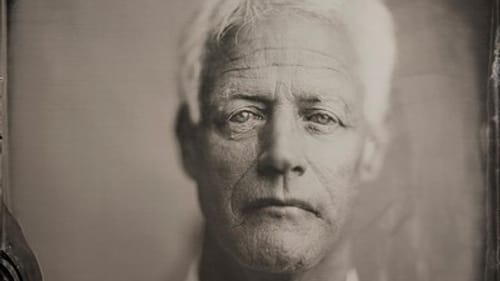 A tintype of Worthen, a white man, in a silvery, solemn, deeply textured tintype image that looks old-fashioned.