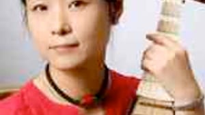 Wu Man and her pipa: Something in common with banjo pluckers.