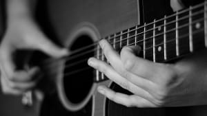 “Annabritt Playing Guitar I” by David Wright. (Photo via Creative Commons/Flickr)
