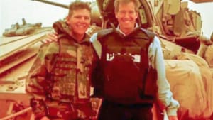 Williams (right) with Terpak in Iraq: A reporter, or a celebrity?