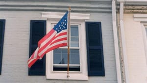 “A Flag on Constitution Avenue” (Photo by Elvert Barnes via Creative Commons/Flickr)