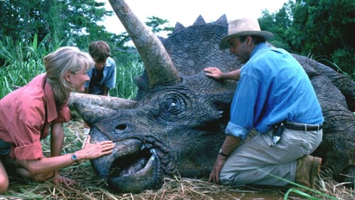 Laura Dern and Sam Neill with real grass and a fake dinosaur in "Jurassic Park" (© 1993 - Universal Pictures).