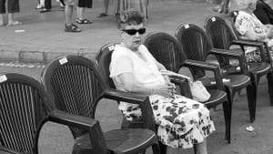 “Old Woman Waiting for the Parade” (photo by José Antonio Morcillo Valenciano via Creative Commons/Flickr)