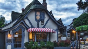 Former lovers meet in “a cinematic version of a quaint English village.” (Fairy-tale architecture in Carmel; photo by Jim Nix via Creative Commons/Flickr)